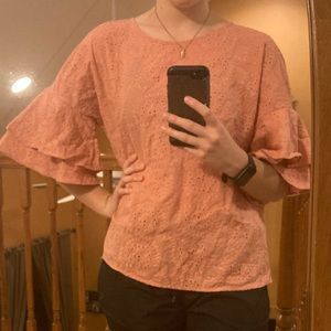 Sooo cute!! The sleeves and patterns are so cute! Peachy pink color.